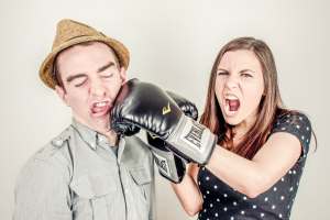 angry woman-man being punched-mad woman-boxing gloves