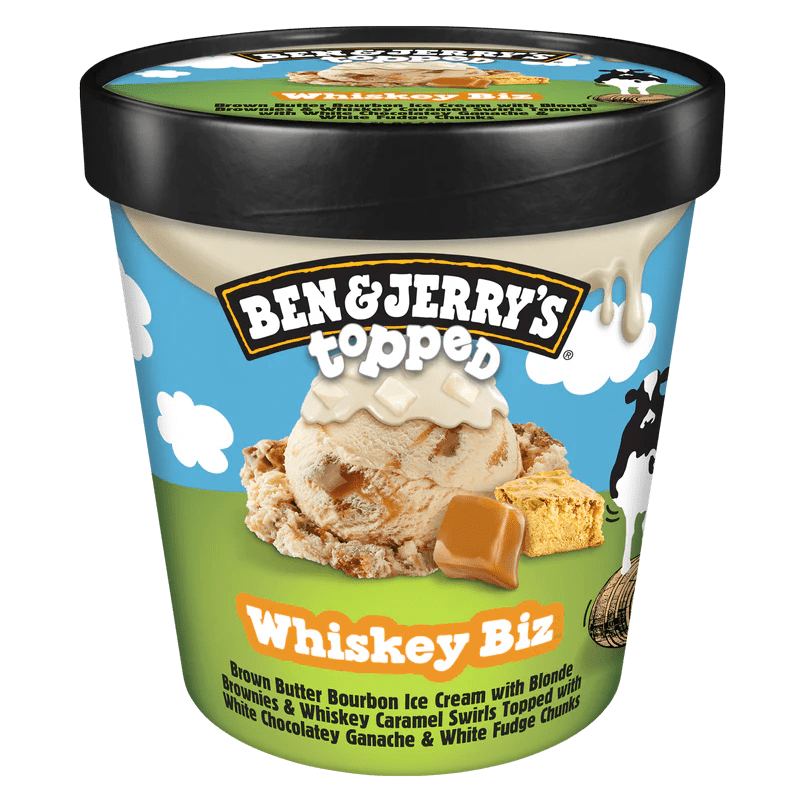 Container of Ben & Jerry's Topped Whiskey Biz ice cream, featuring brown butter bourbon ice cream with blonde brownies and whiskey caramel swirls, topped with white chocolate ganache and white fudge chunks.
