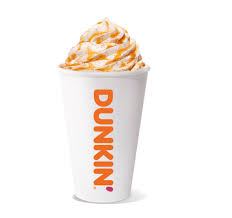 A cup of Dunkin' frozen beverage topped with whipped cream and caramel drizzle, featuring the Dunkin' logo.